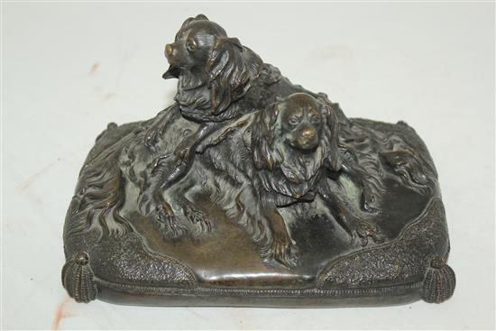 A late 19th / early 20th century patinated bronze group modelled as two spaniels, 8.5in.